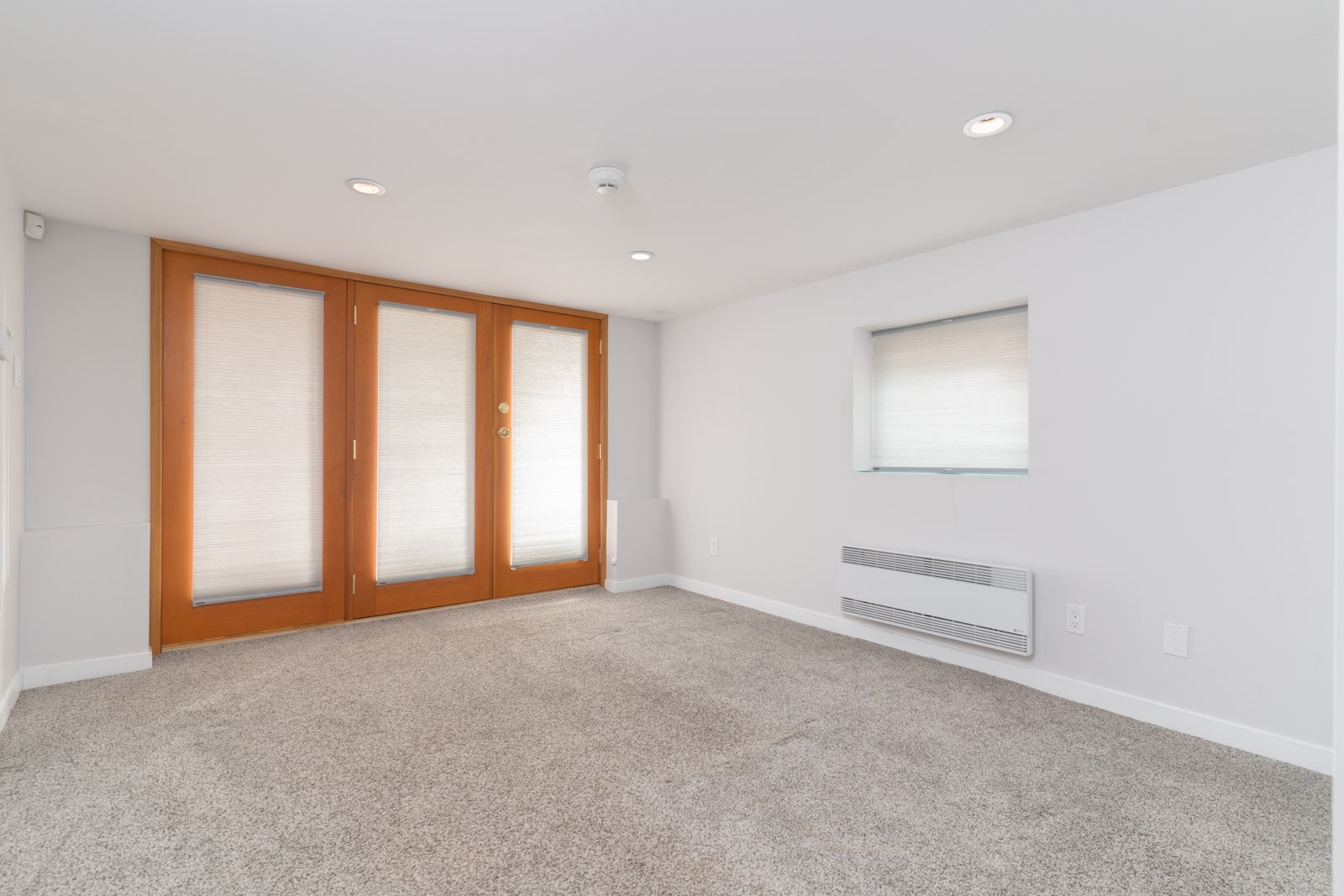 Wide bedroom with walk-in-closet in a basement home in Vancouver