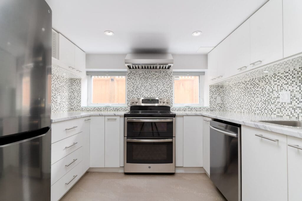 High end appliances in a beautiful basement suite managed Birds Nest Properties