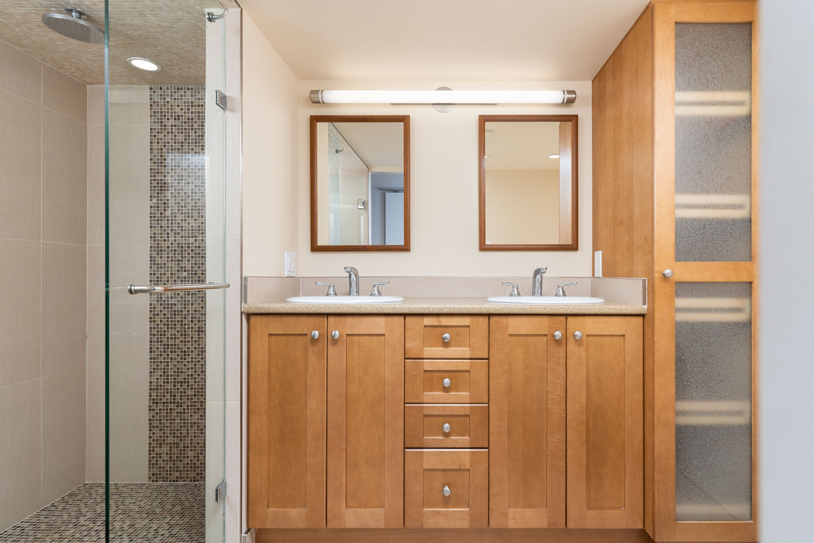 Beautiful wood finishing in the bathroom with his/her sink