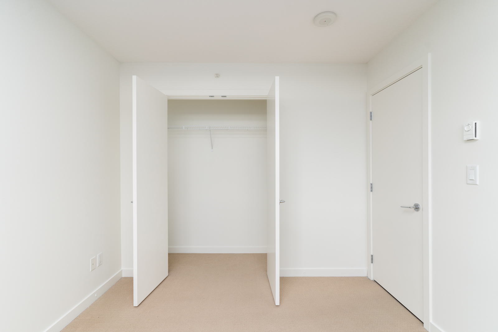 walk-in closet in rental condo managed by Birds Nest Properties
