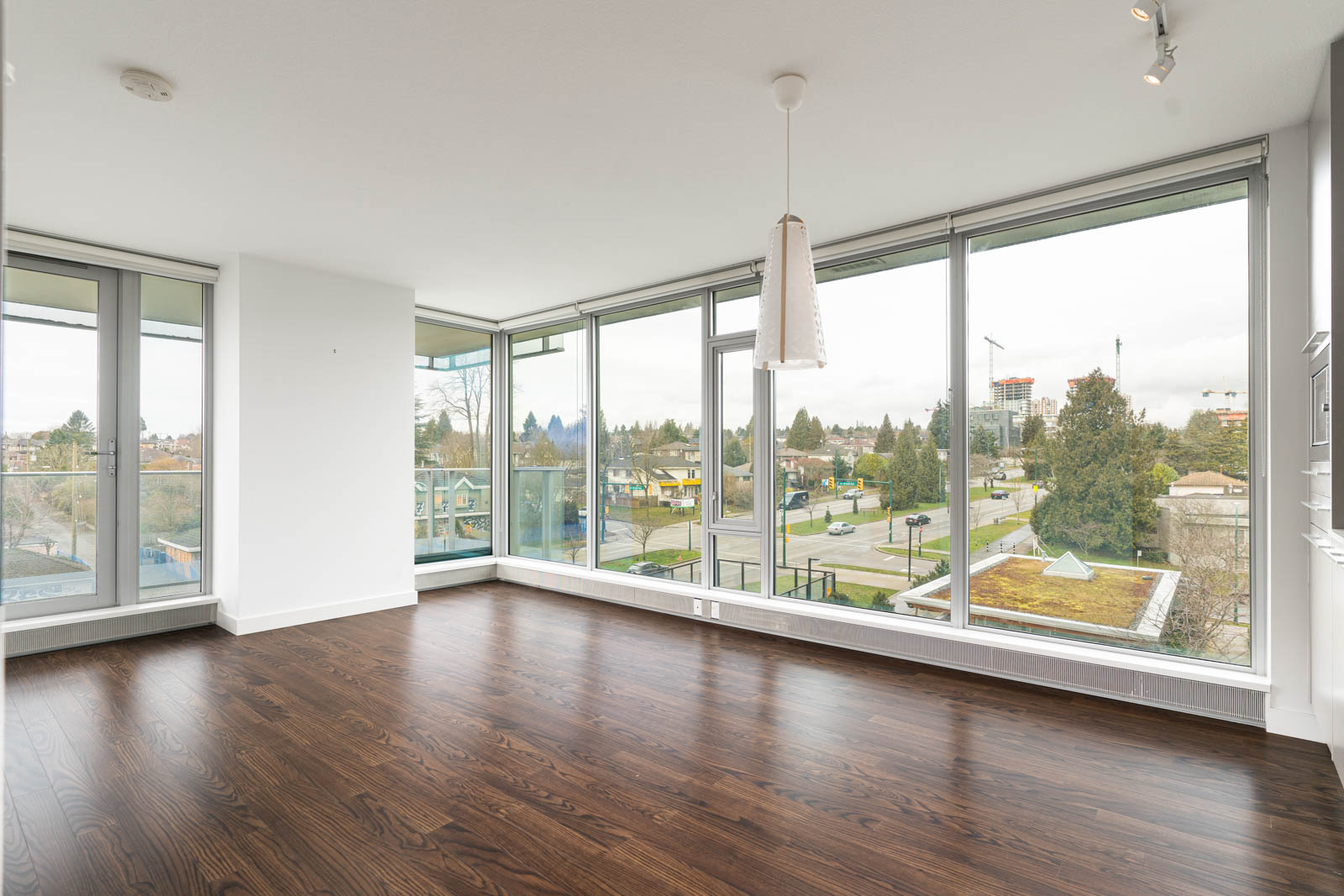 living room with laminate floors in rental house in the Marine Drive neighbourhood of Vancouver