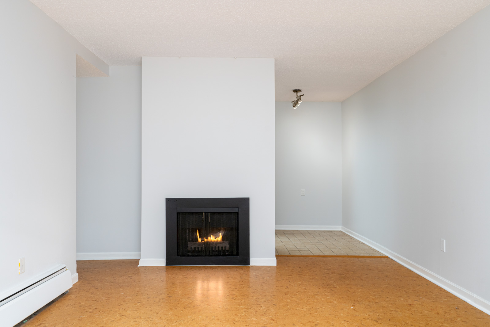 living room with white walls near cozy fireplace in mount pleasant