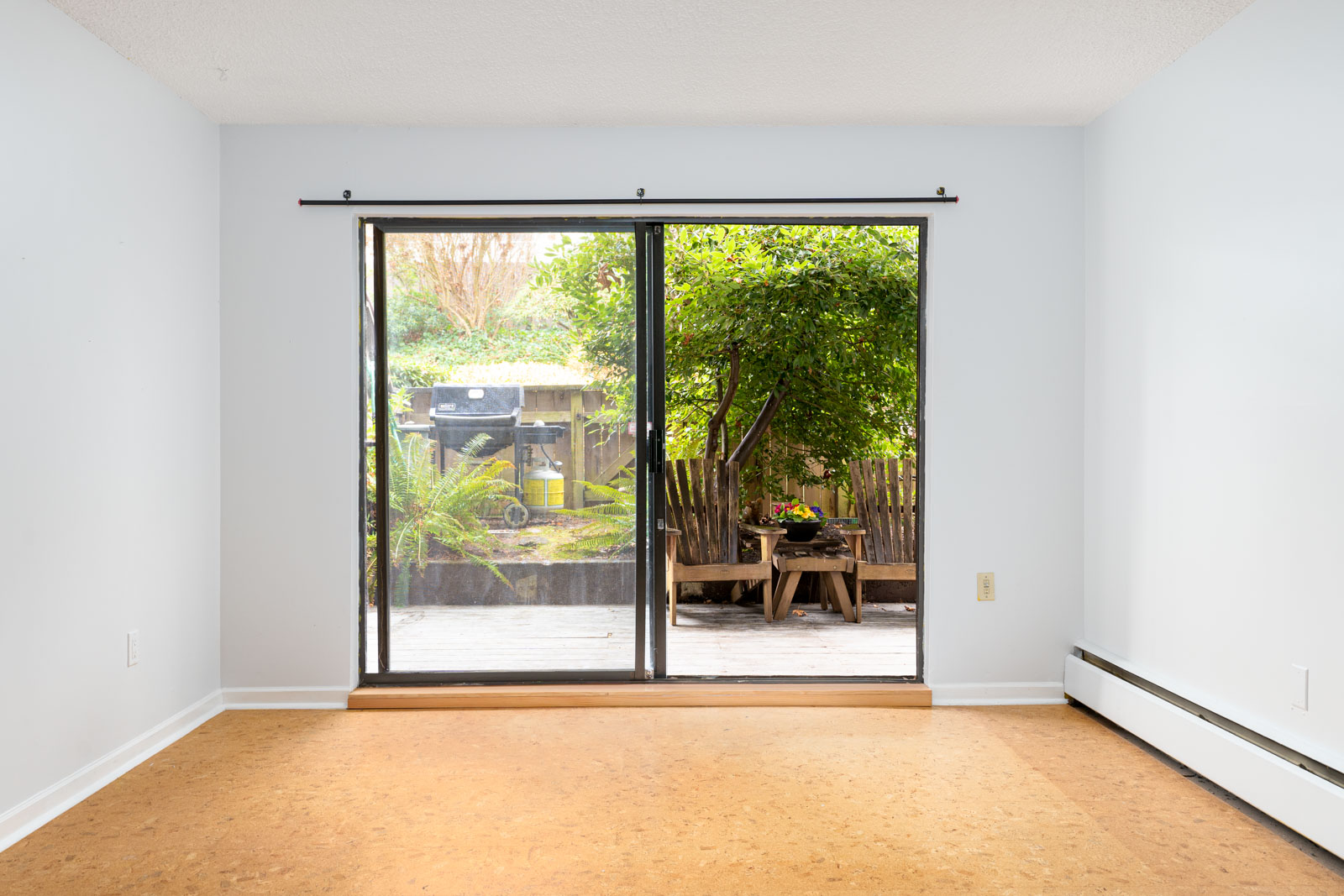 bright living room balcony nature view in mount pleasant neighborhood in vancouver