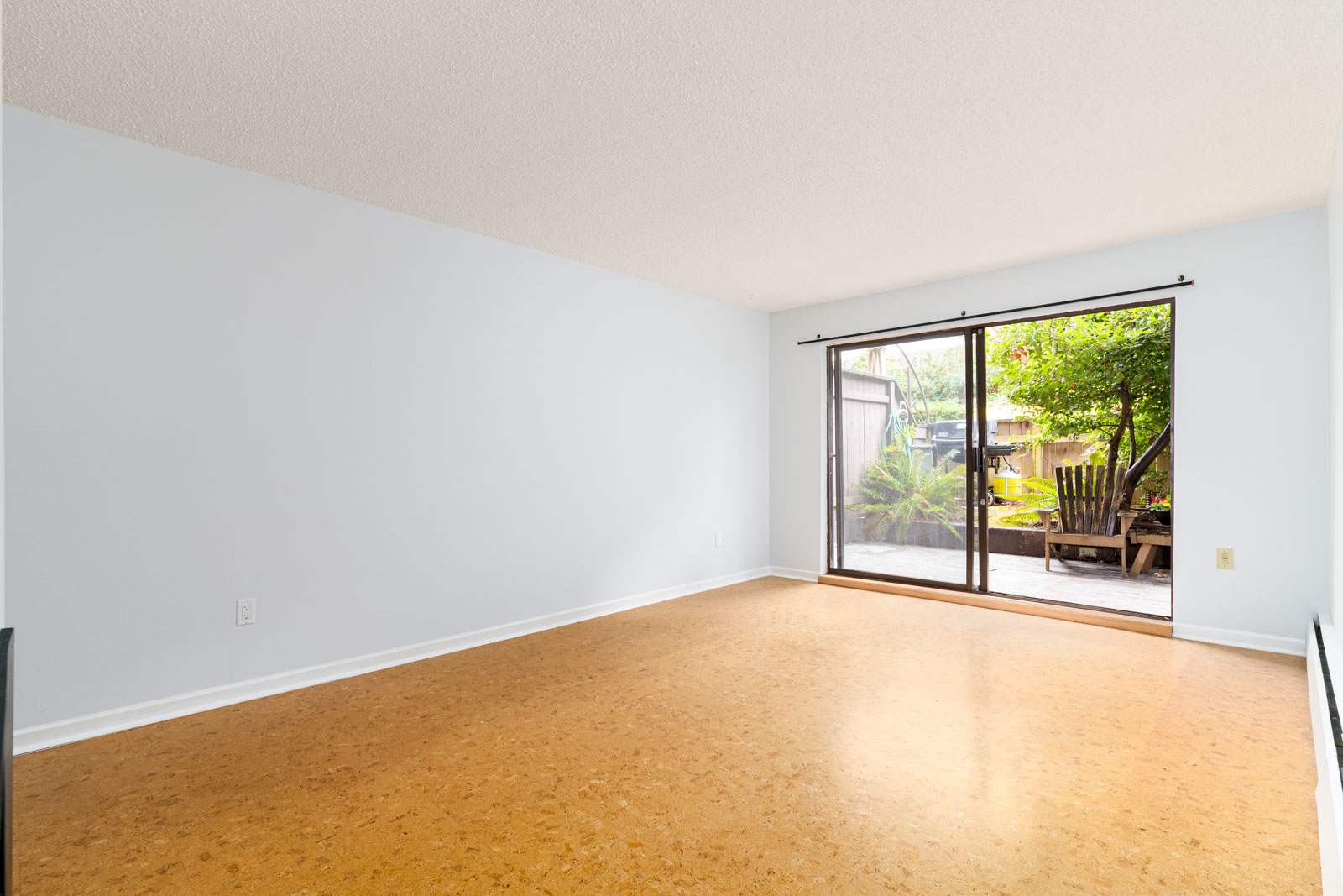 spacious and bright condo in landmark manor with large backyard in east vancouver;
