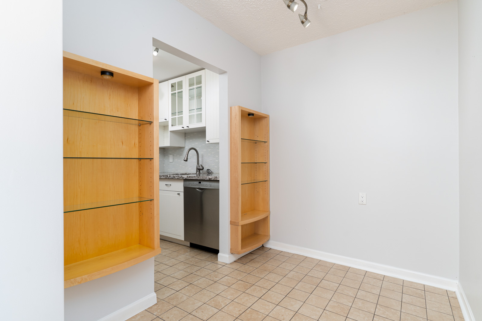 bright condo in east vancouver in mount pleasant neighborhood with white walls and dishwasher