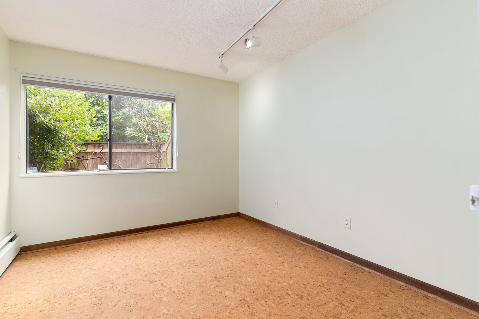 spacious living room in condo located in vancouver in mount pleasant neighborhood