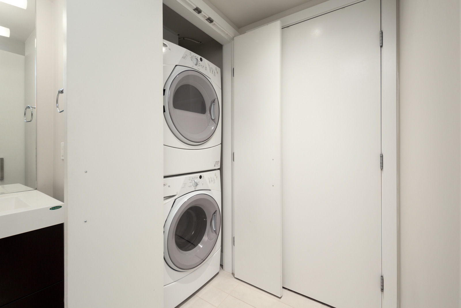 in-suite laundry unit in luxury condo managed by Birds Nest Properties in Downtown Vancouver