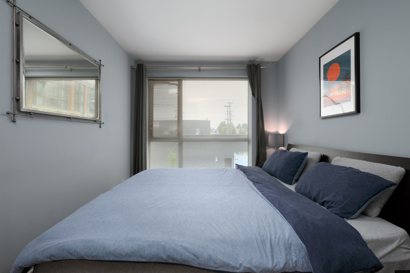 bedroom with closet in rental condo at Arbutus Outlook in the West End neighbourhood of Vancouver