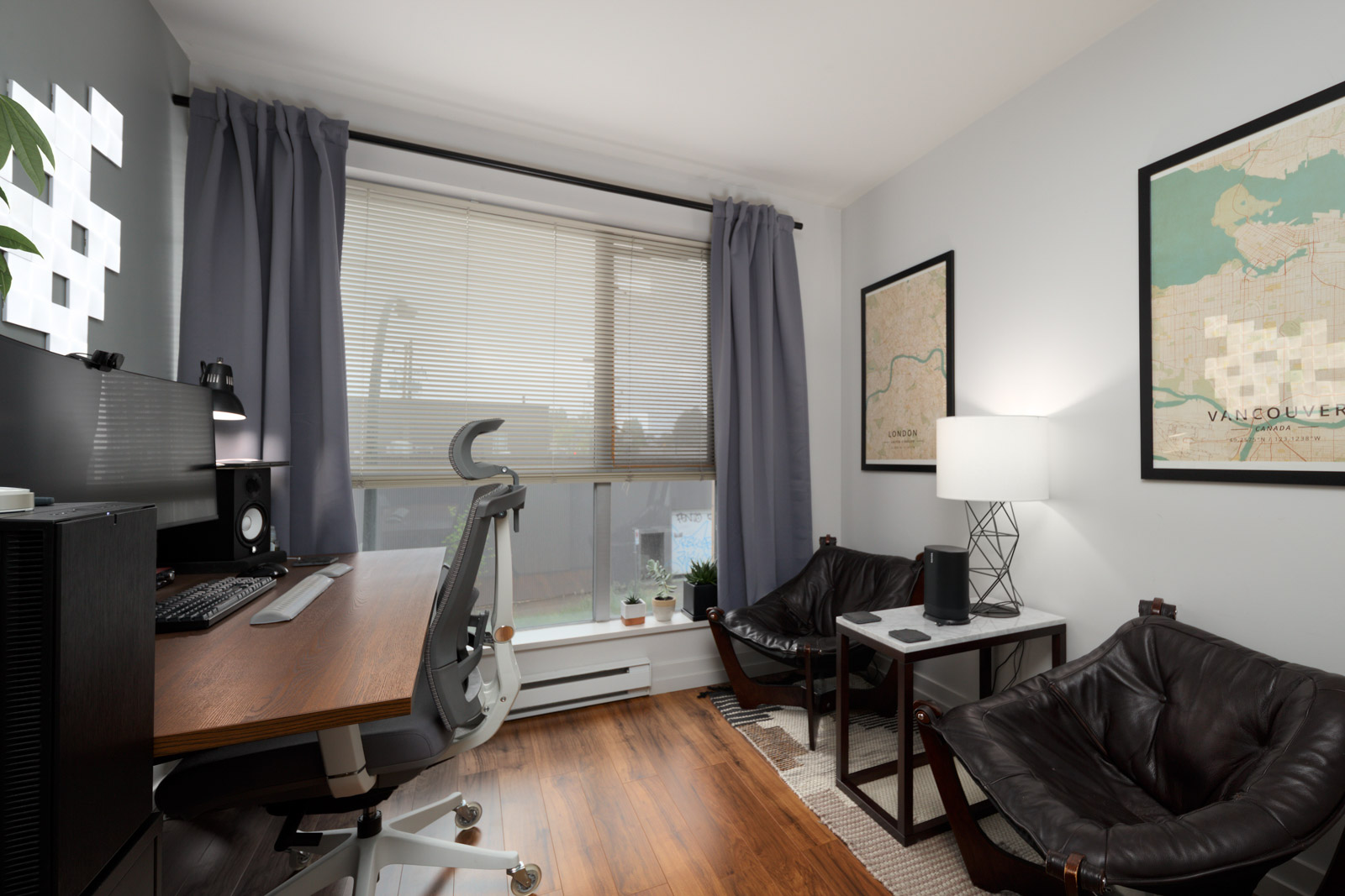 den with white walls and hardwood floors and floor to ceiling windows in rental condo in Vancouver
