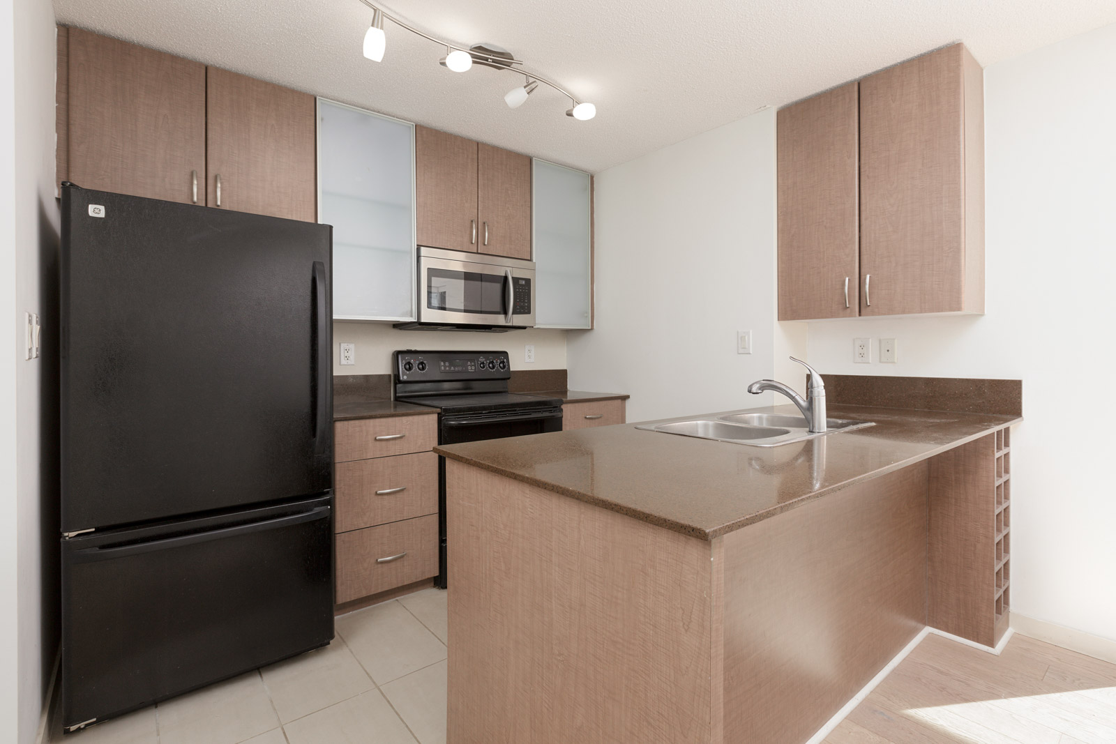 kitchen with brown countertops and brown wood in downtown vancover