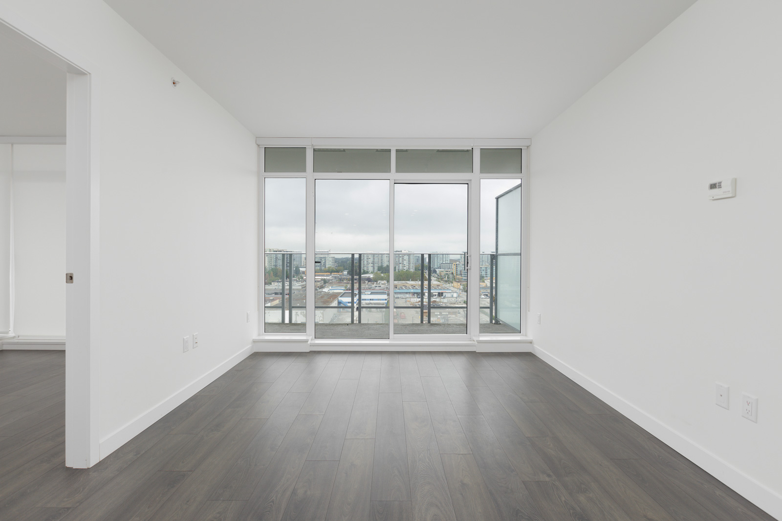 Cozy living with hardwood in furnished Orchid Building on the 13th floor