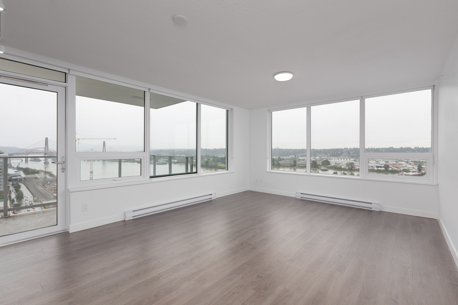 laminate floors and big windows in a modern condo in new Westminster