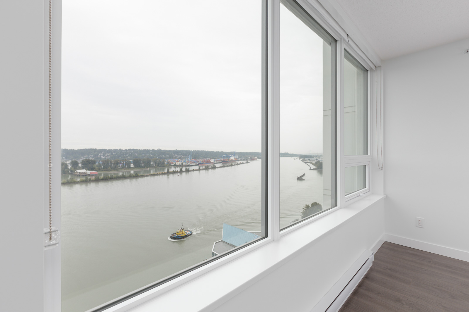 view from the window on a river located in new Westminster