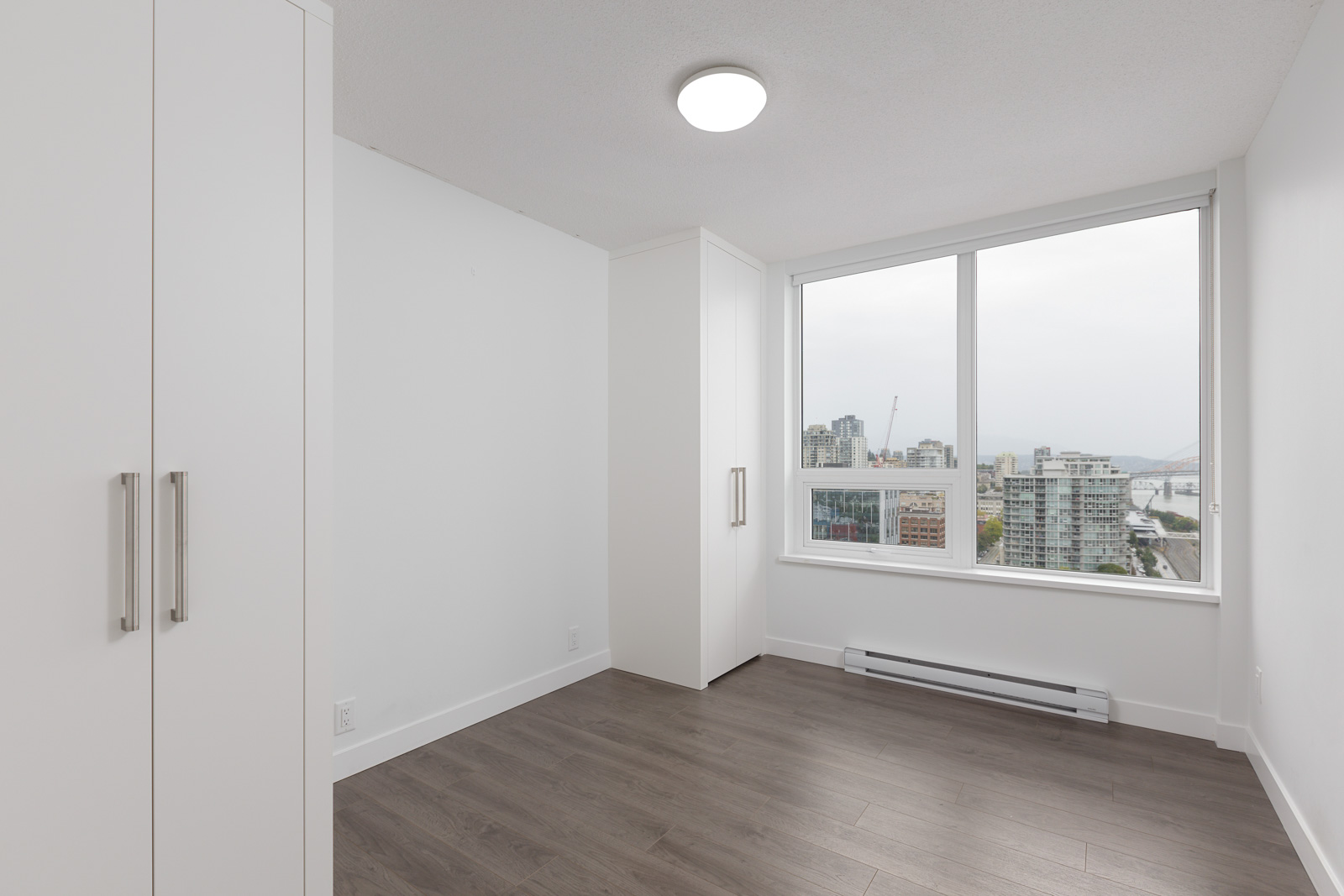 bright bedroom in a condo located near the rived in new Westminster with a view