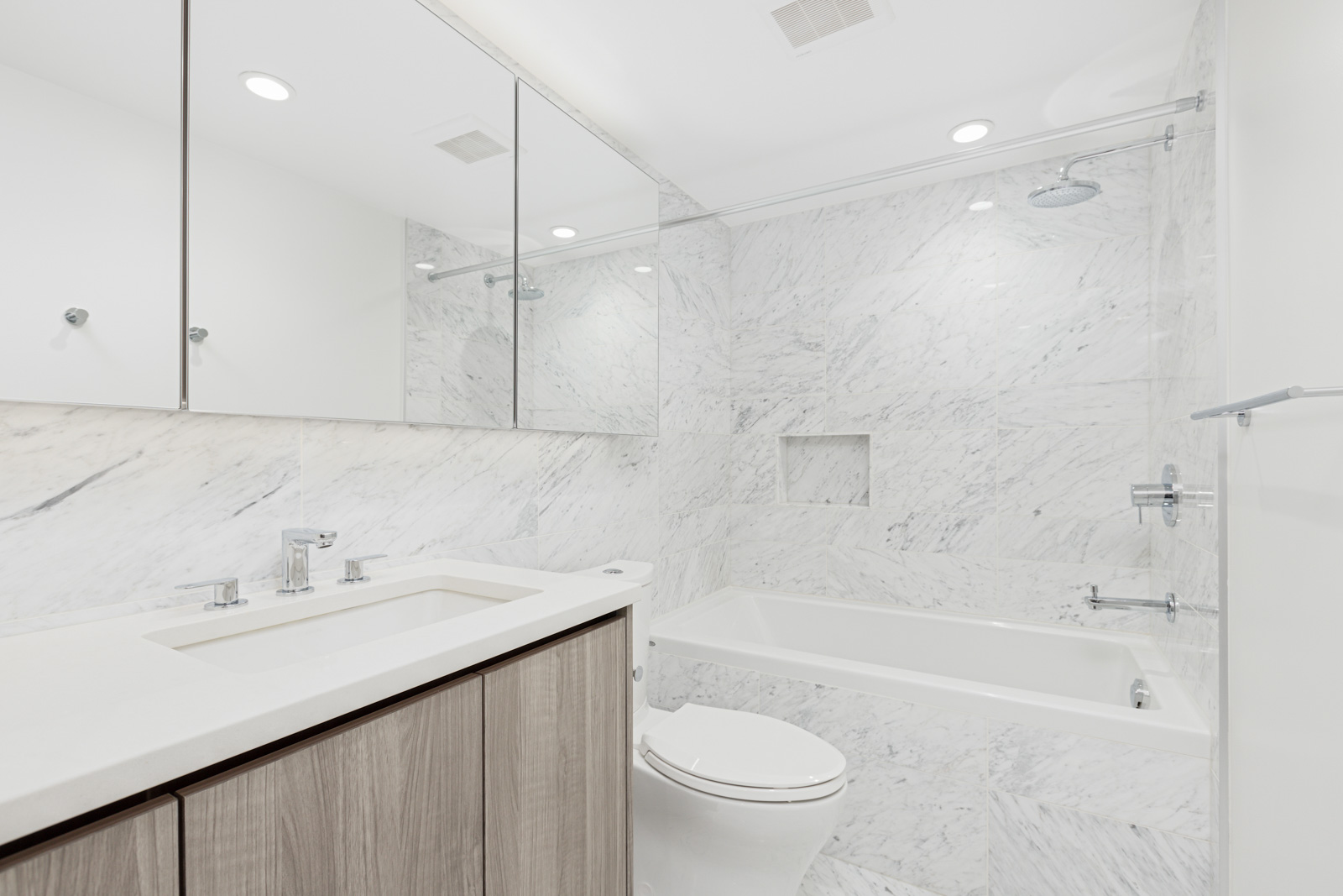 bathroom in newly built Olympic Village condo