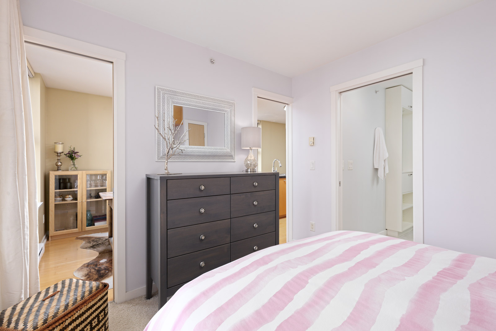 furnished bedroom in Yaletown condo with pink bedding