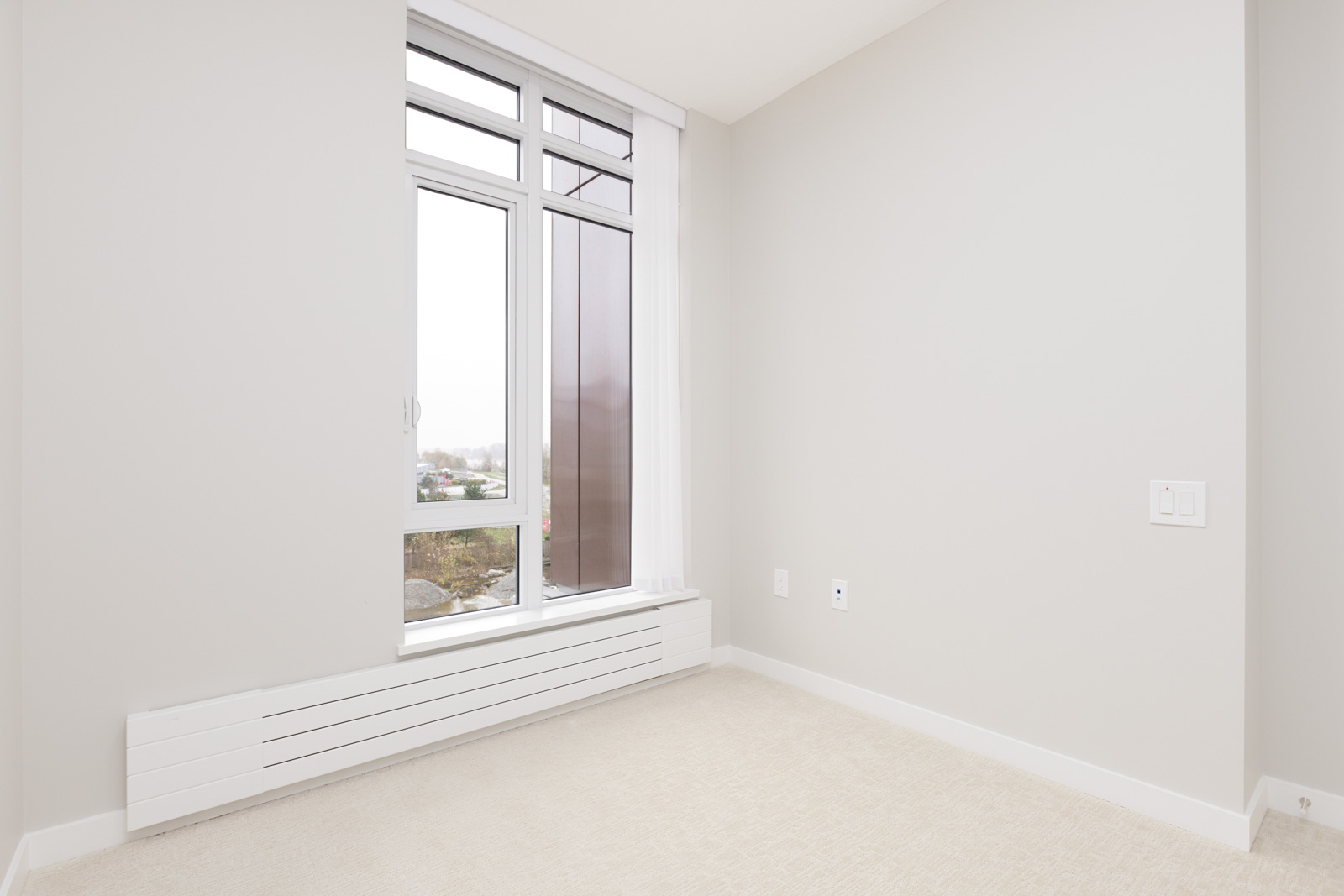 bedroom in newly-built condo in Vancouver
