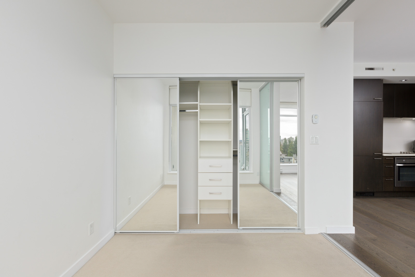 bedroom closet in upscale condo in Vancouver's Fairview neighbourhood