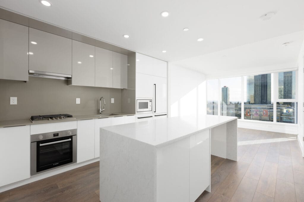 white kitchen island with floor-to-ceiling windows