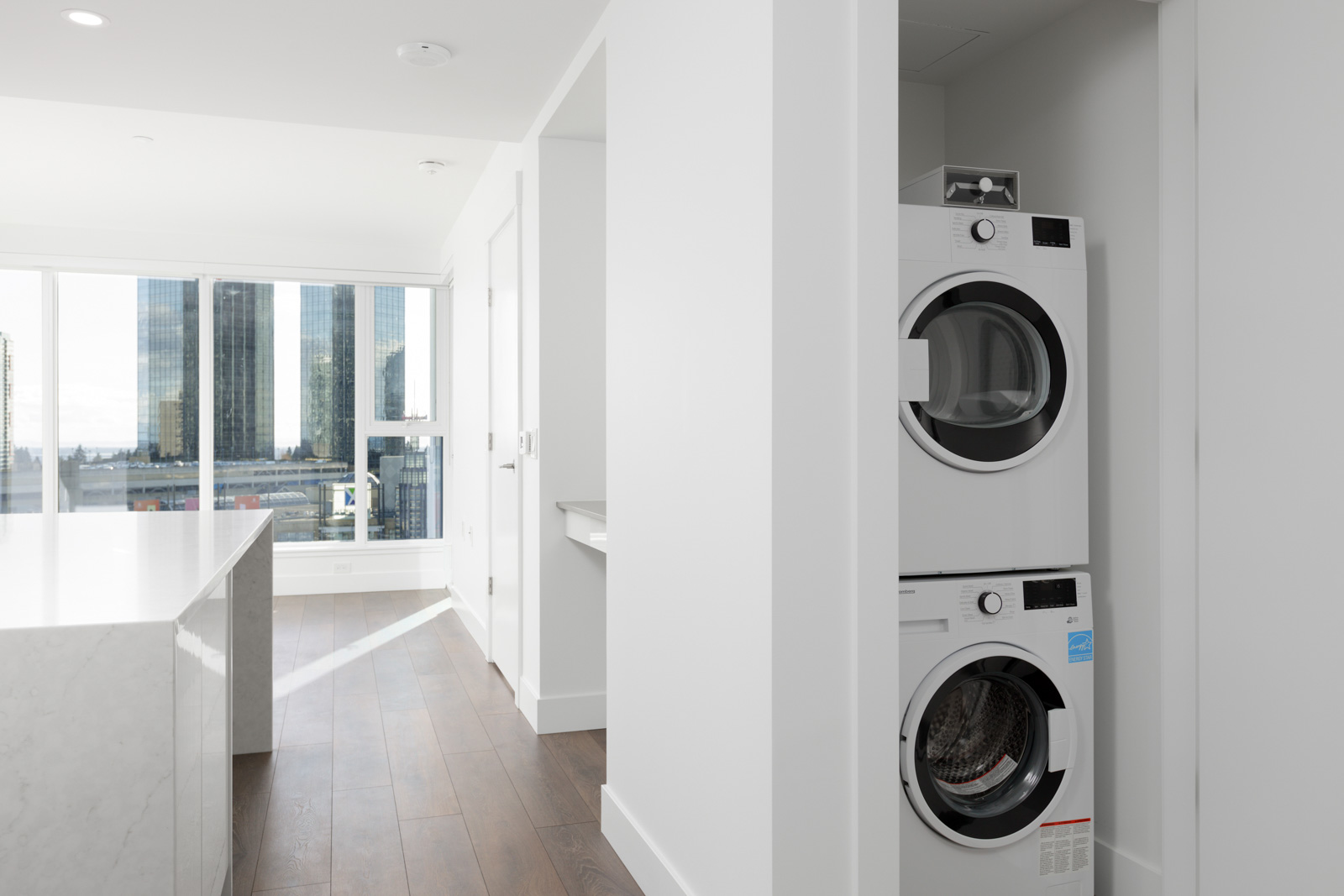 hallway view and washer and dryer closet