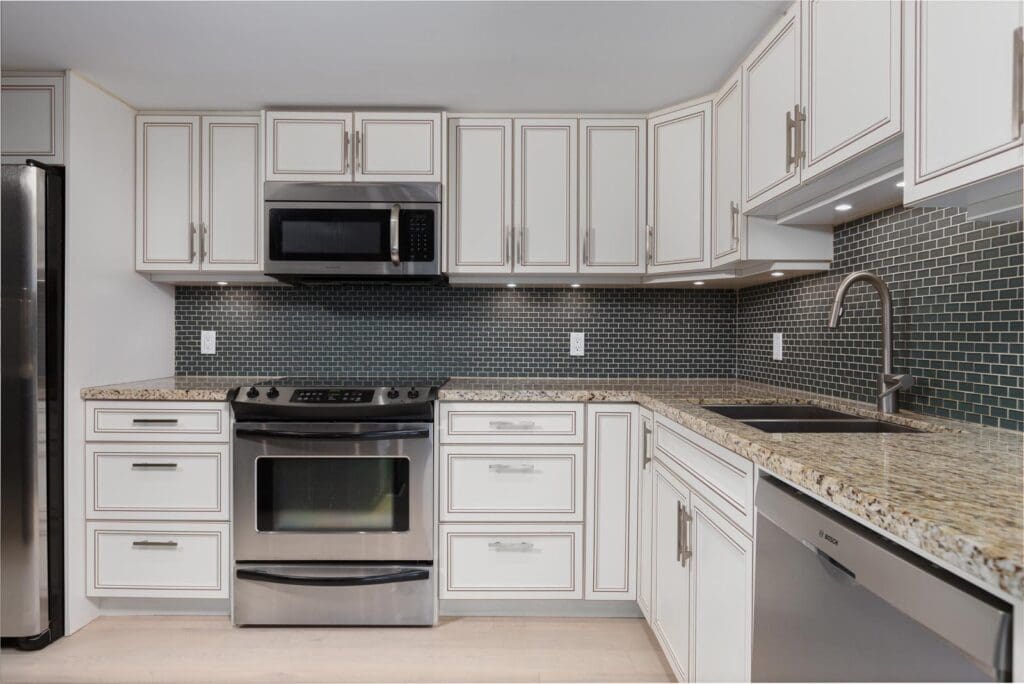 kitchen with off white cabinets and appliances