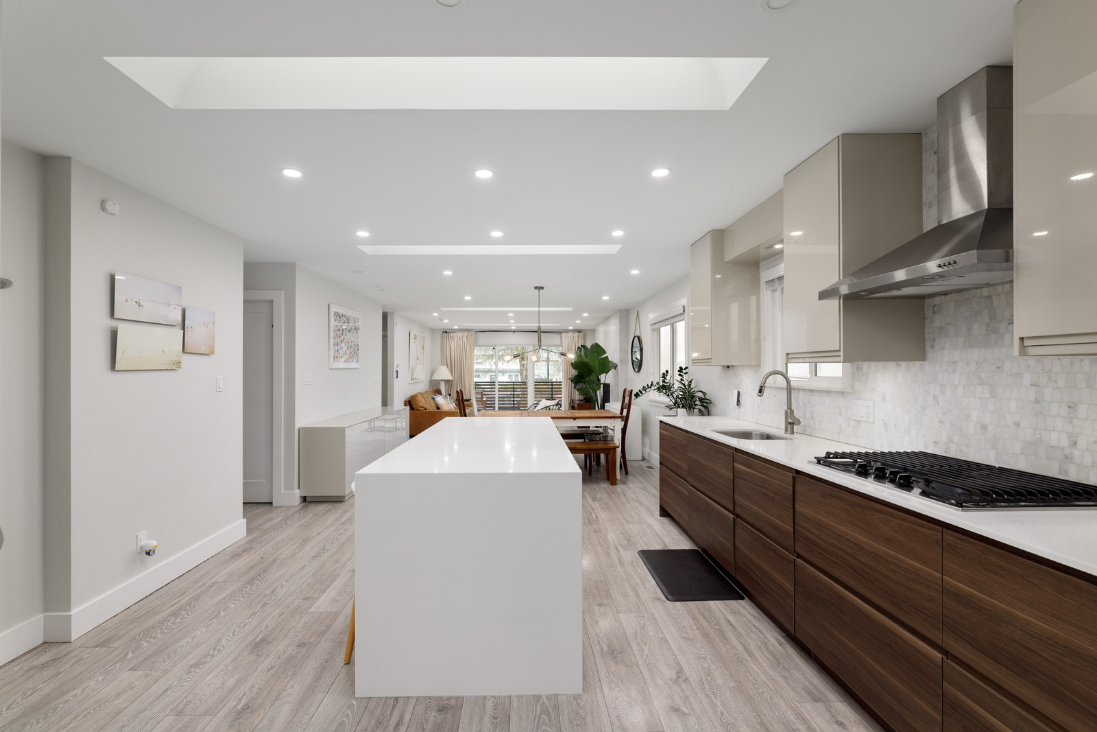 Open-plan kitchen and living area with skylight in a Metro Vancouver rental house managed by Birds Nest Properties